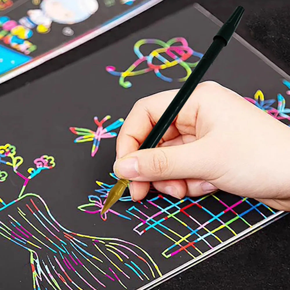 A white scratch art pen tool for children's crafts on scratch paper.