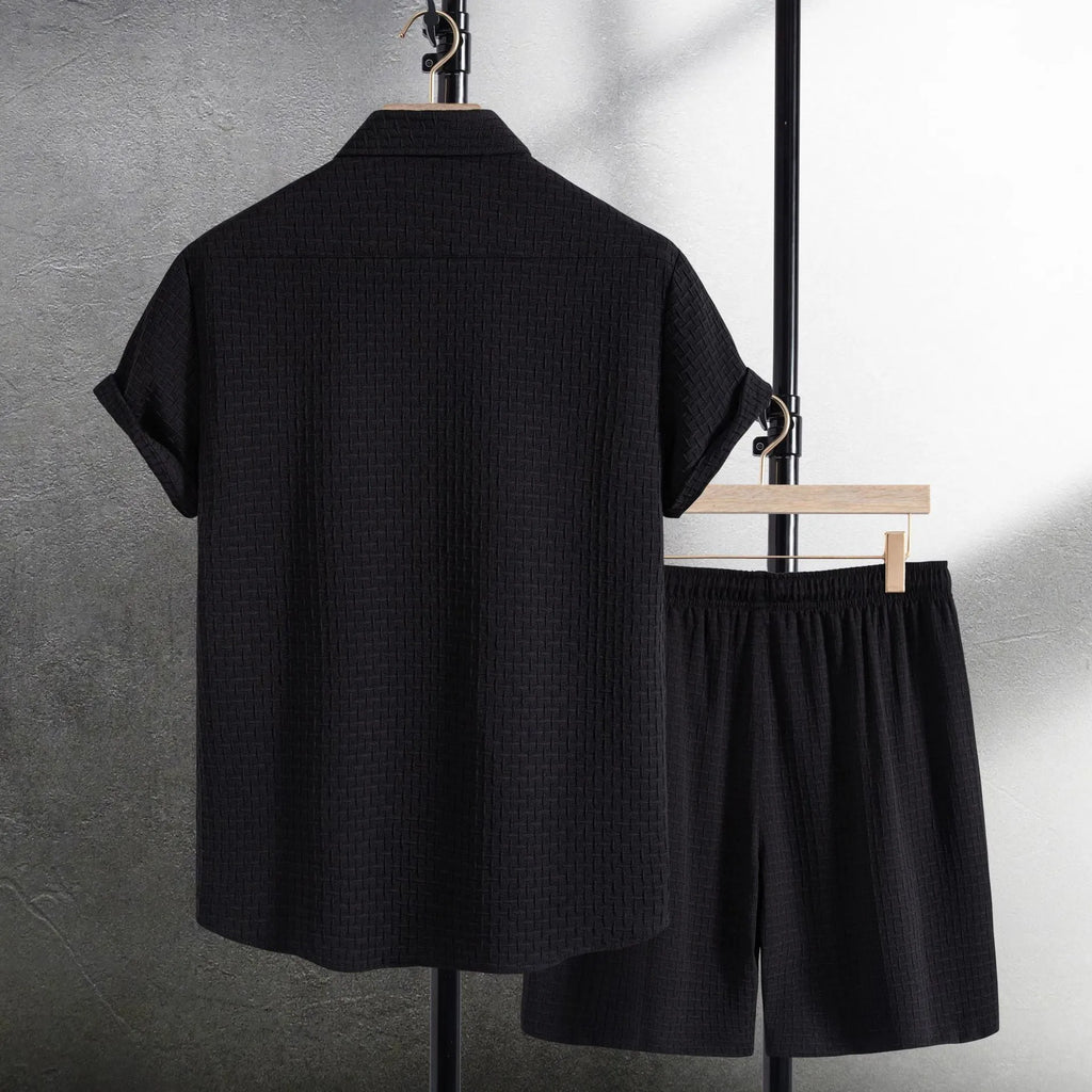 Men's black cotton blend short sleeve shirt and matching shorts set displayed together
