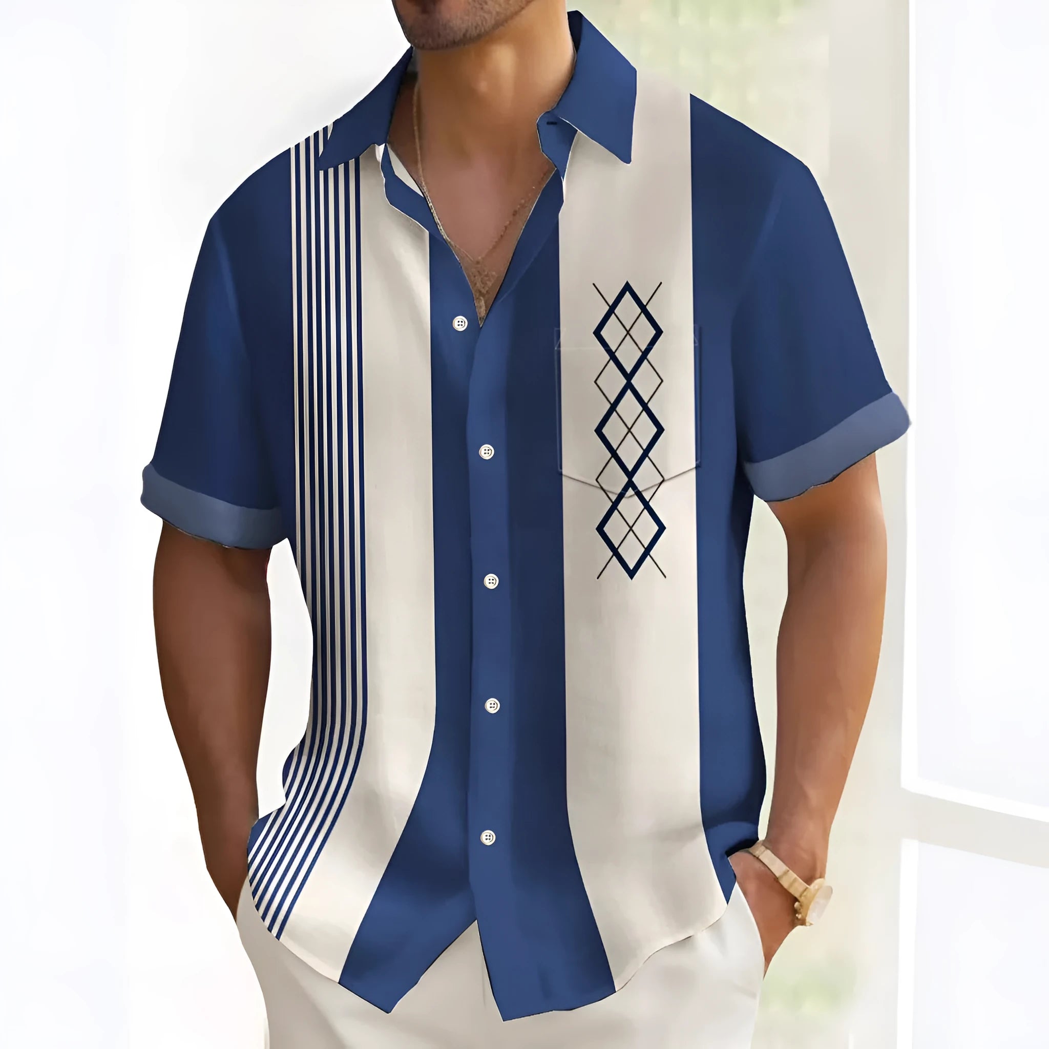 Man wearing a loose-fitting, multicolour printed cardigan-style polyester shirt.