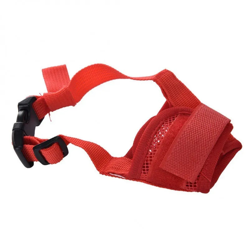 Adjustable plastic basket-style dog muzzle in red, shown on a dog's snout with quick-release buckle.