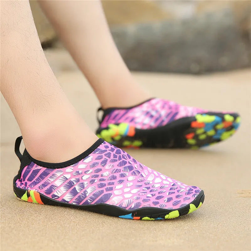 Beach wading shoes with stretch Lycra uppers and EVA midsoles in blue, black, pink, purple, and camouflage colours