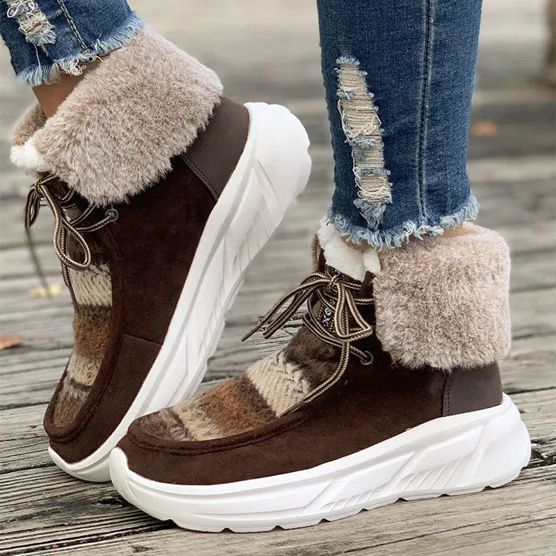 Women's beige lace-up snow boots with suede upper, thick rubber sole, and decorative stitching