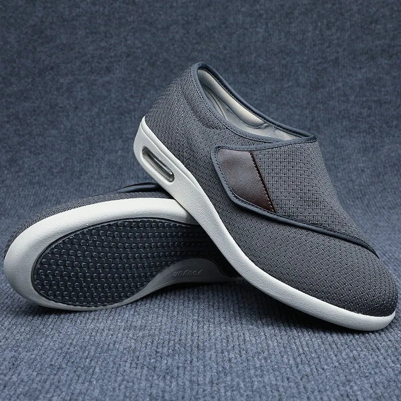 Beige leisure shoe with a velcro strap closure and a rounded toe, shown on a neutral background