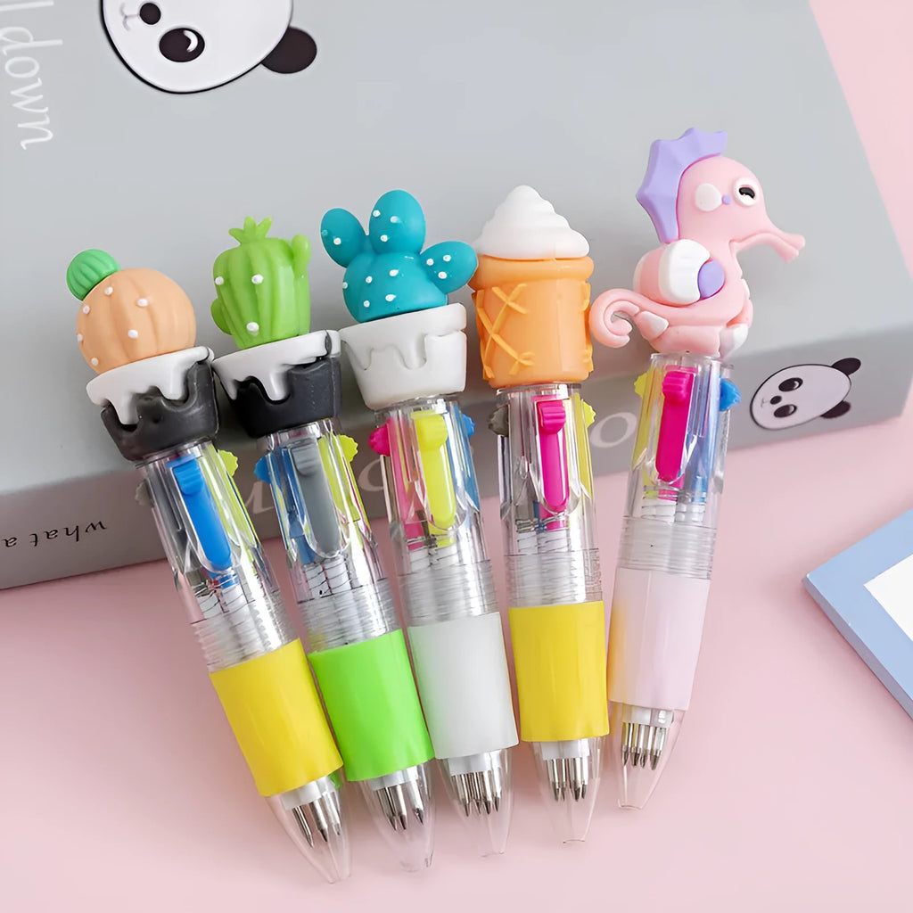 A cartoon-themed press-type ballpoint pen showing four-colour cartridge and a random print design on a silicone and plastic barrel.