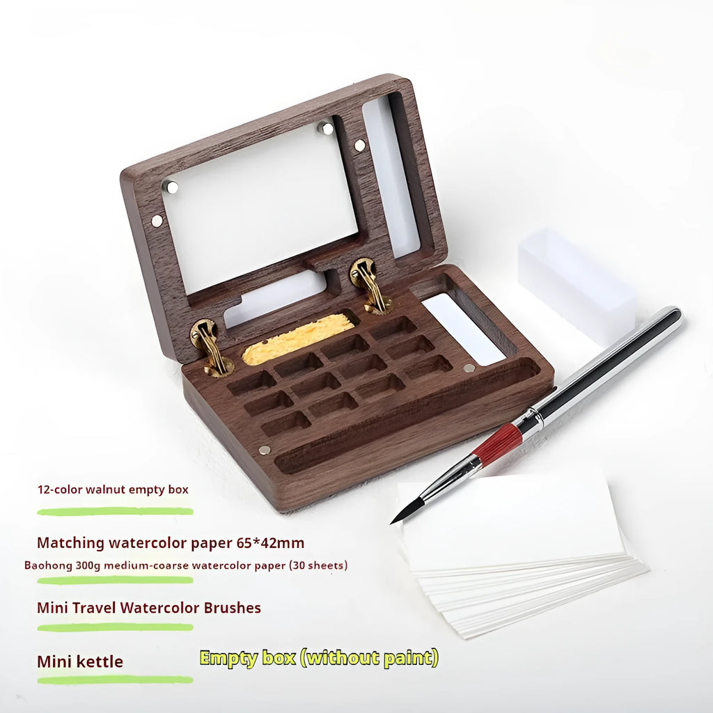 Mini walnut wood watercolour paint box open to show pigment pans with leather carrying bag