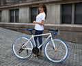 Aluminium alloy road bike with double disc brakes and bend handlebars in silver colour