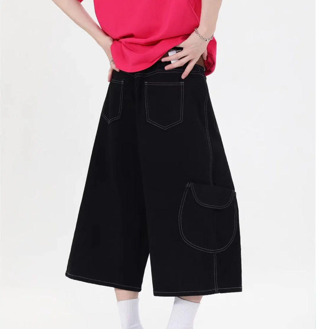 Retro denim workwear shorts with wide leg cut and multiple pockets in red colour