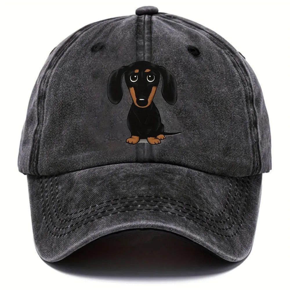 Retro washed blue cotton baseball cap with a printed dachshund design on the front and a peaked brim.