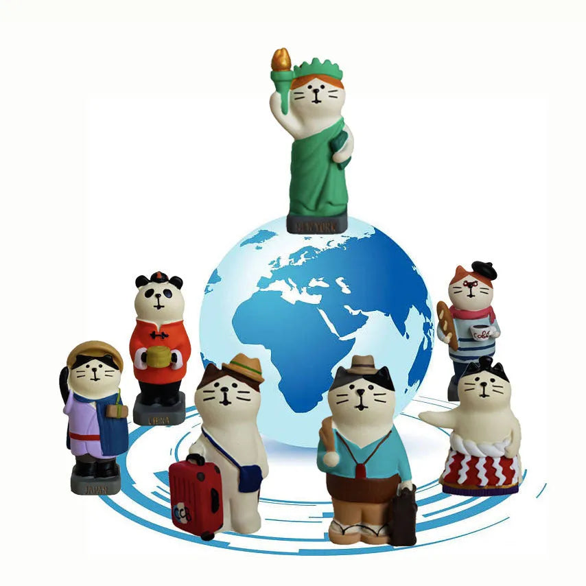 Cartoon cat resin figurine with Statue of Liberty and globe travel theme.