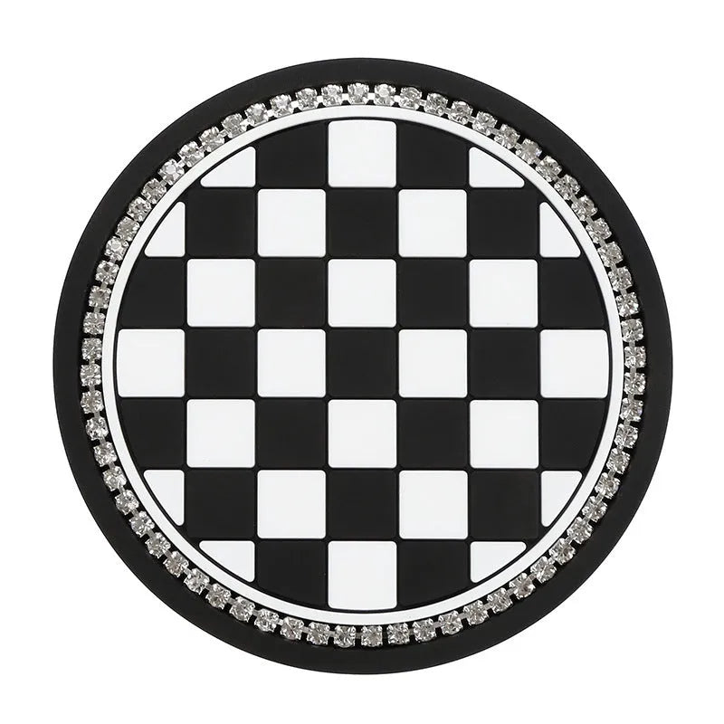 Black and white checkerboard PVC car cup holder mat inserted into vehicle centre console slot