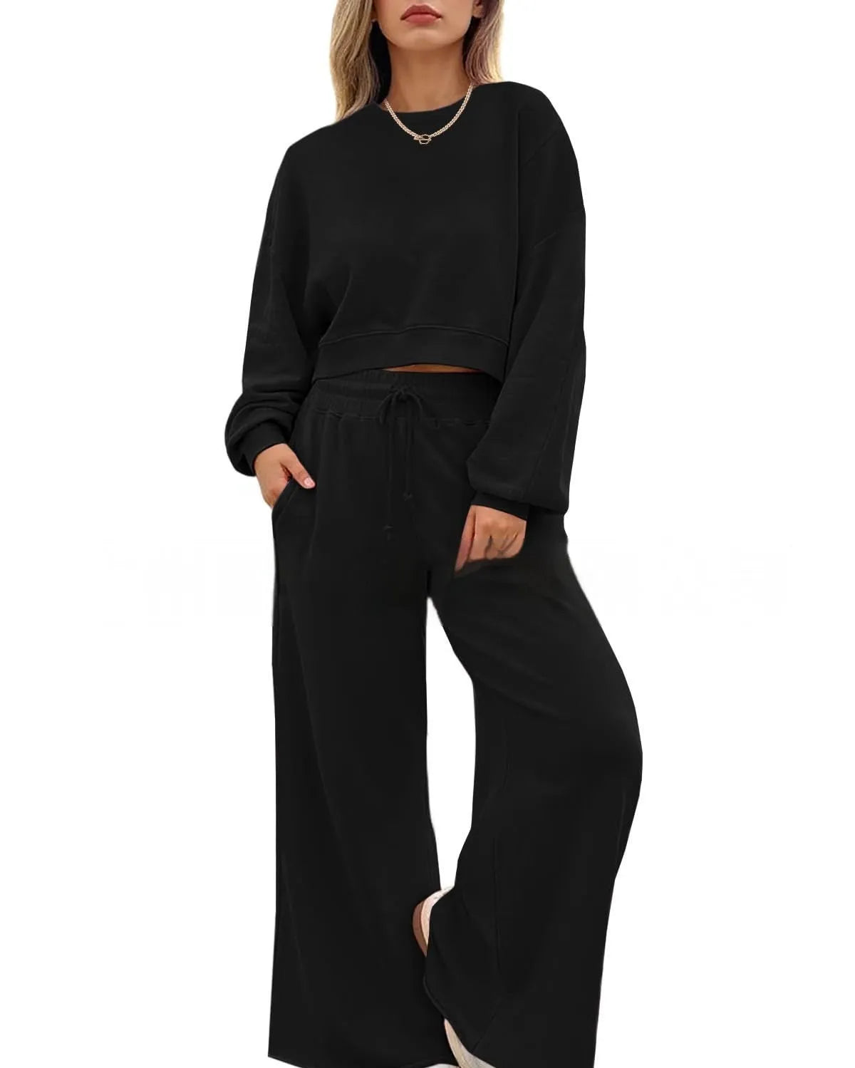 Women's solid colour polyester two-piece casual set with long sleeves and trousers.