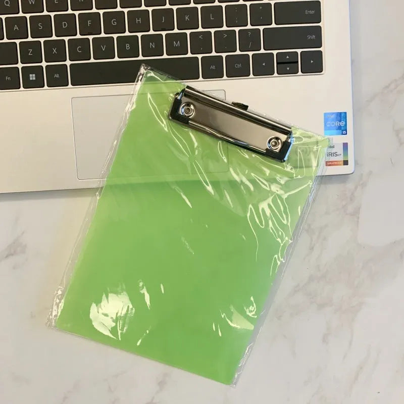 Transparent A4 plastic writing board pad with a silver metal clip, shown in blue colour.