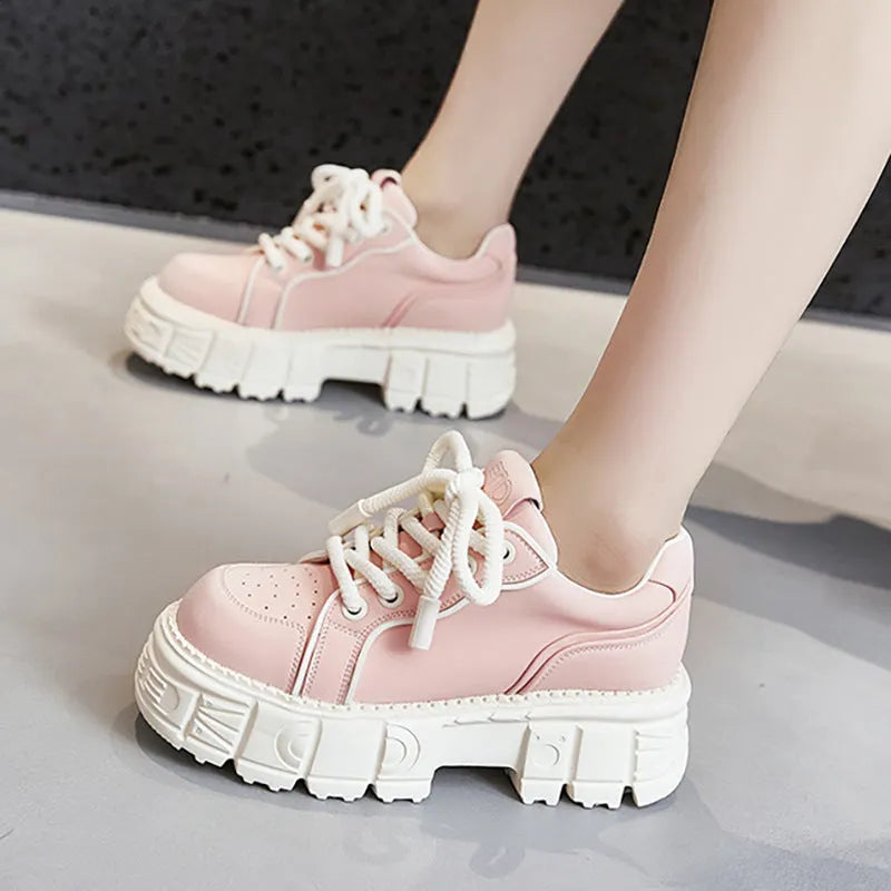 Women's beige muffin bottom leather casual shoes with wedge heel on white background