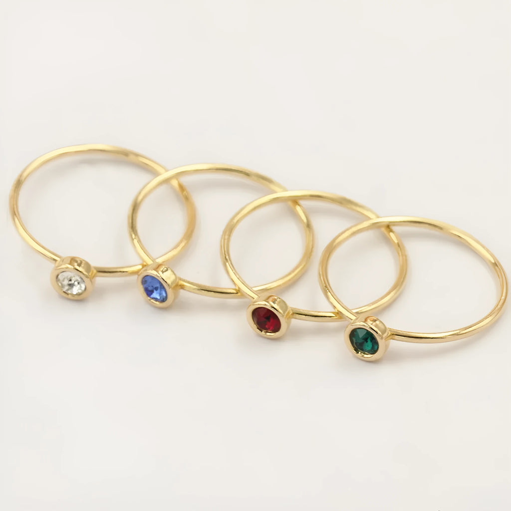 14K gold-plated GF zircon knuckle ring on finger in green colour