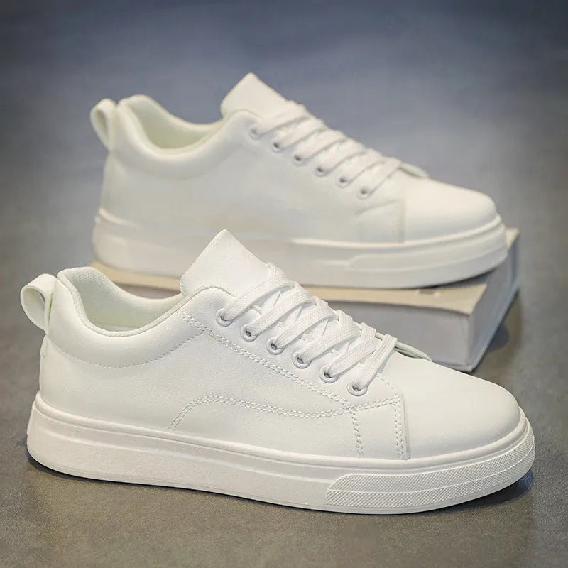 Men's Korean-style low-top sneakers in white, black, or two-tone colour with flat rubber sole