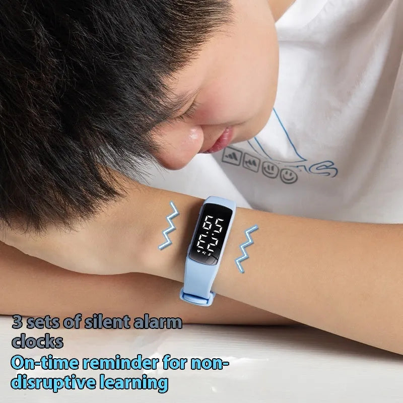 Black vibration alarm smart watch with LED display on a silicone strap, showing 50m waterproof rating.