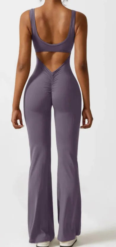 Women's black yoga bodysuit with hollow seam design and built-in chest pads