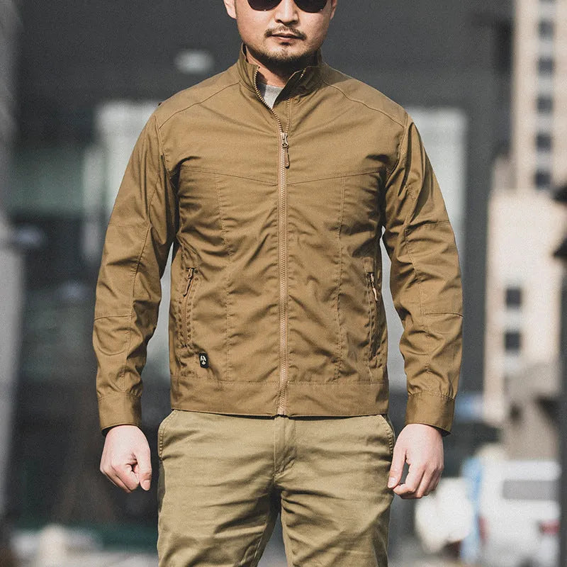 Men's brown polyester tactics assault jacket with camouflage pockets on a mannequin.