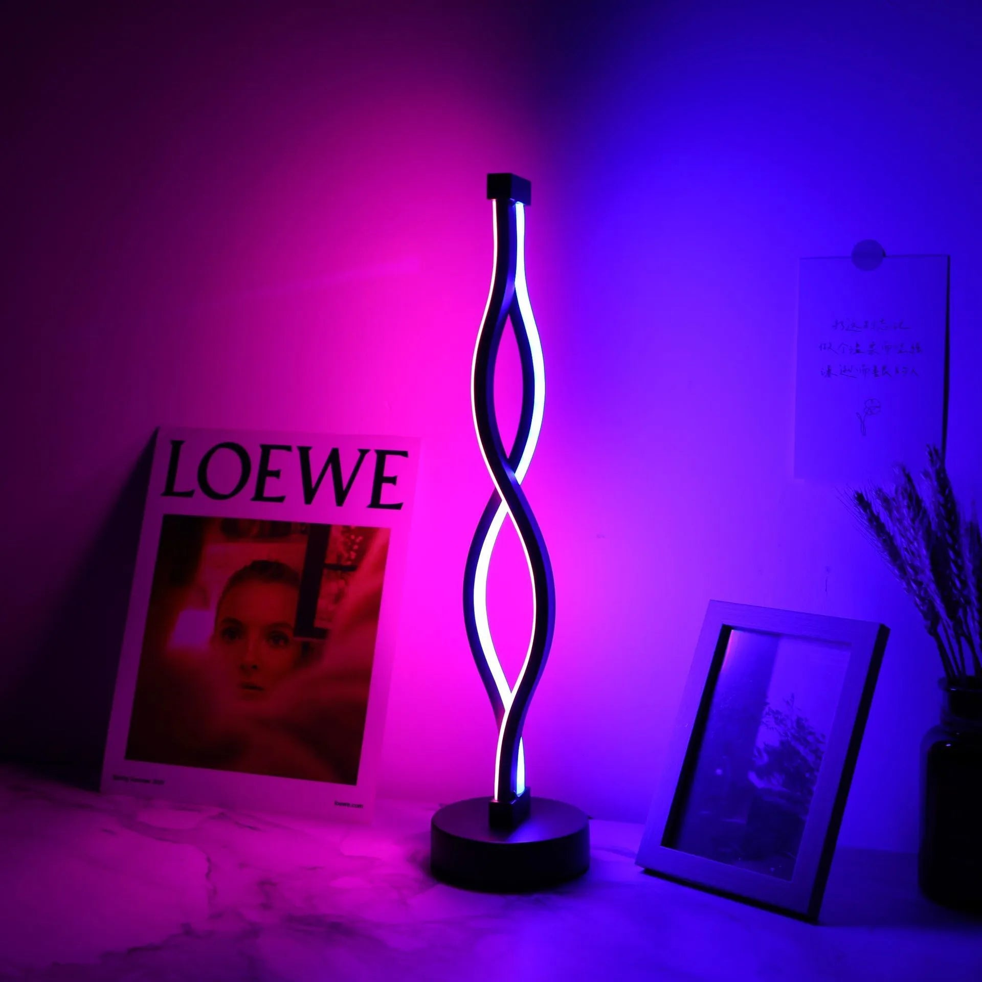 Black aluminium desk lamp with touch dimming controls and USB power cable