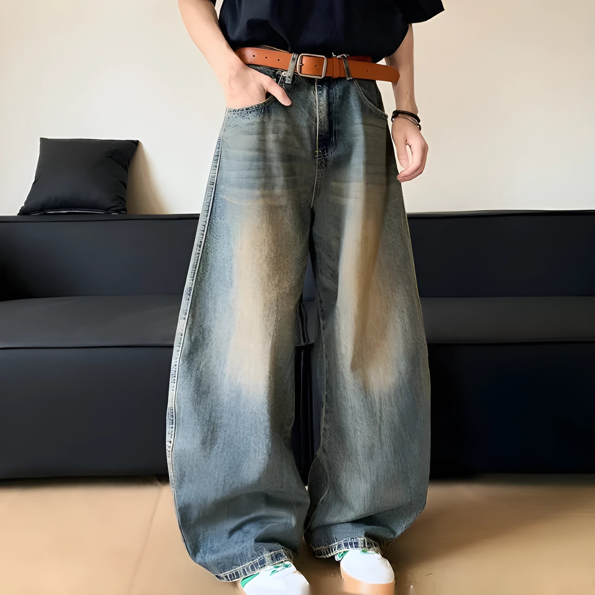 Men's retro blue distressed denim pants with a slim wide-leg fit and a zipper fly.