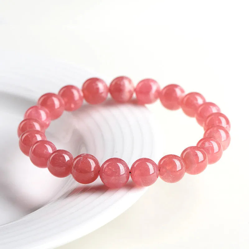 Women's red rhodochrosite crystal bracelet with geometric design and longevity lock fastening