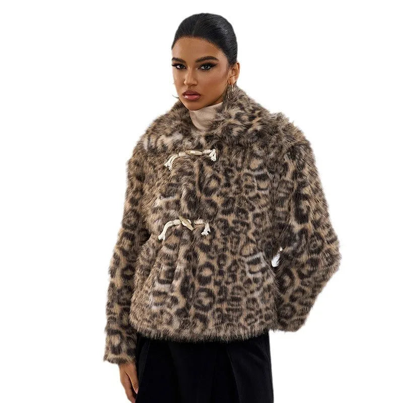Women's leopard print coat with buckle lapel detail showing normal length street fashion design