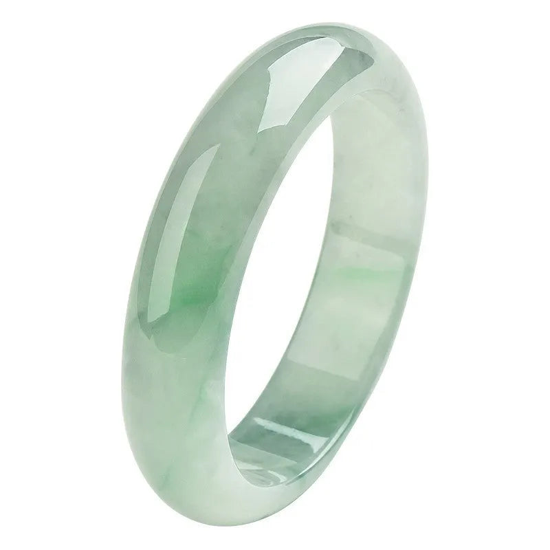 Light green jade bracelet showing natural stone texture with sizing chart displaying 53mm to 64mm circumference options