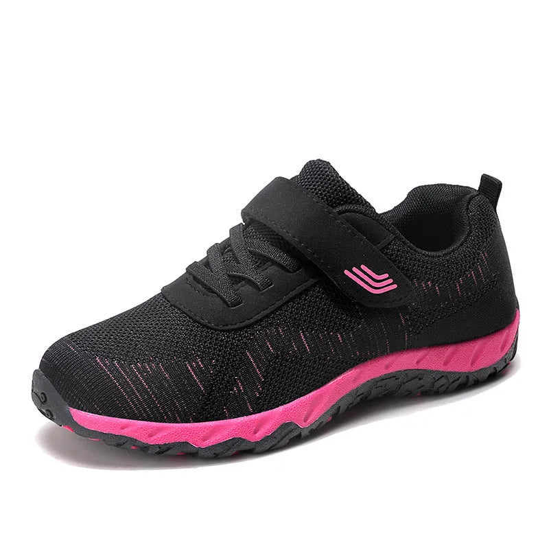 Women's low-top wedge heel shoes with mesh upper and Velcro strap in a solid colour.