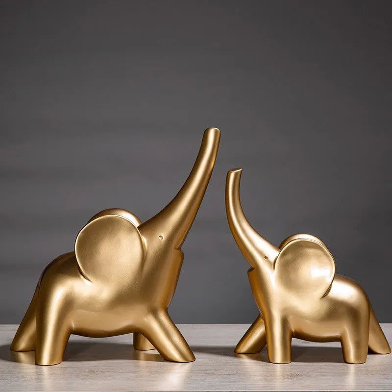 Modern resin elephant ornament in rose gold colour displayed on wooden surface