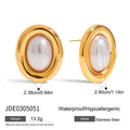 A pair of silver-colour stainless steel stud earrings with a small white pearl detail on a grey background.