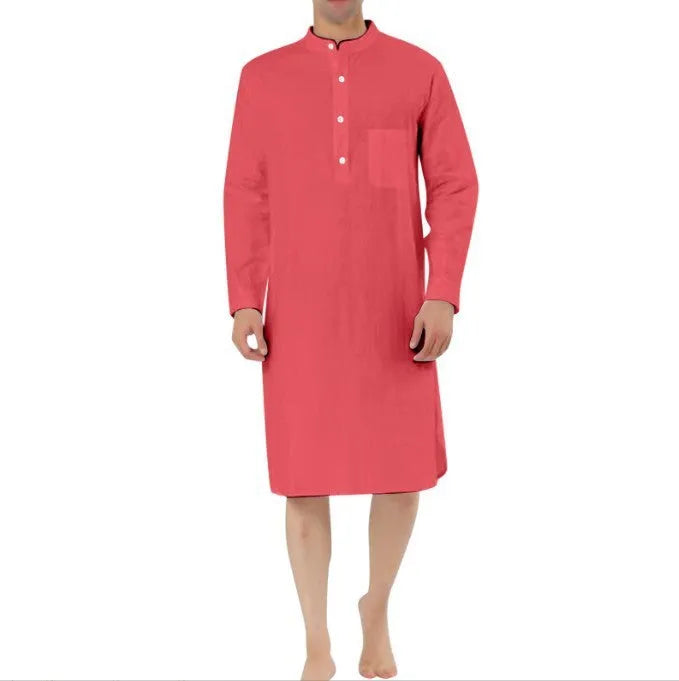 Man wearing a dark blue cotton robe shirt with button front and chest pocket