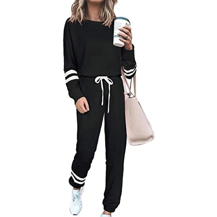 Women's loose-fitting casual suit set in a solid colour, comprising a long-sleeve top and matching trousers.