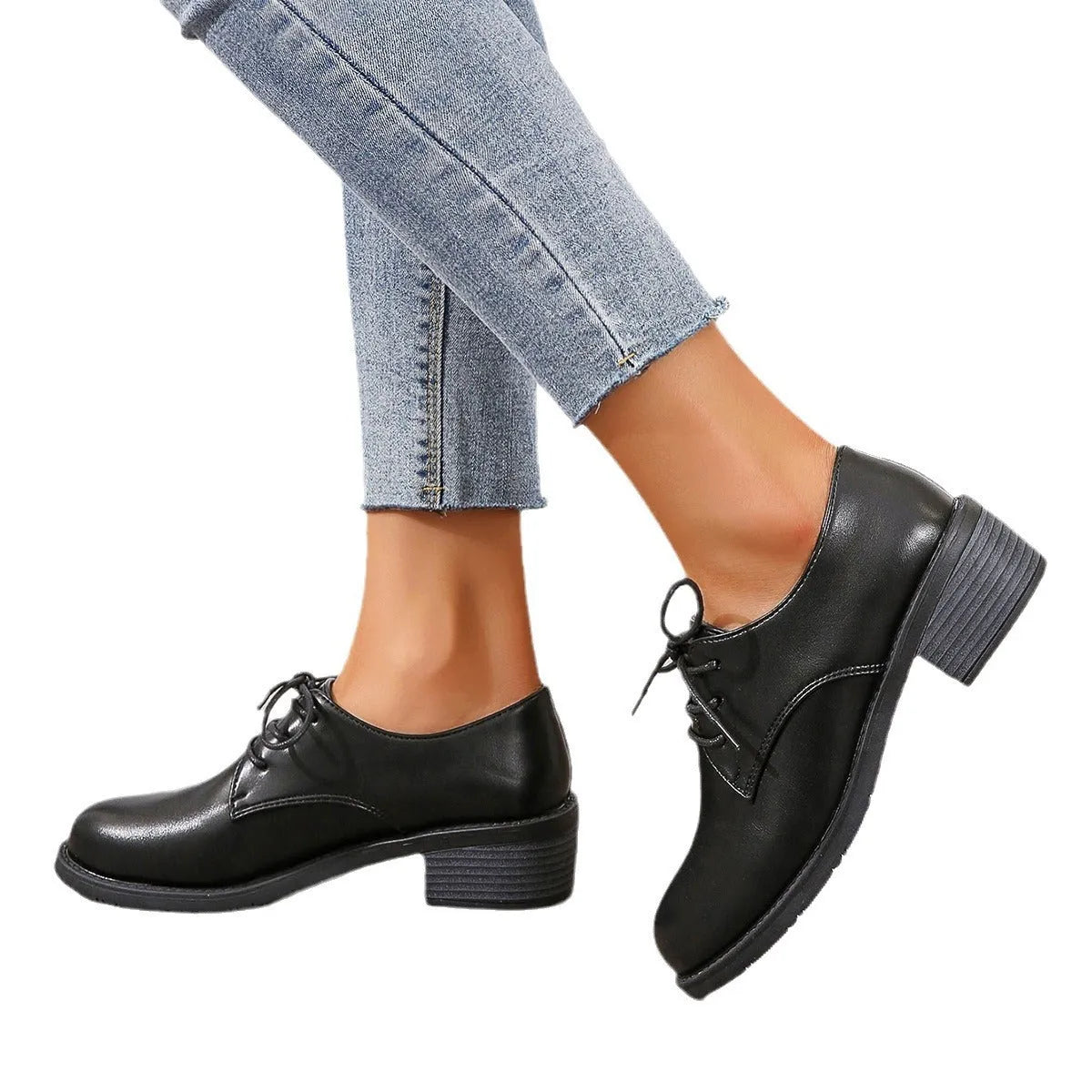 Black women's low-top shoes with a chunky thick heel and rubber sole.