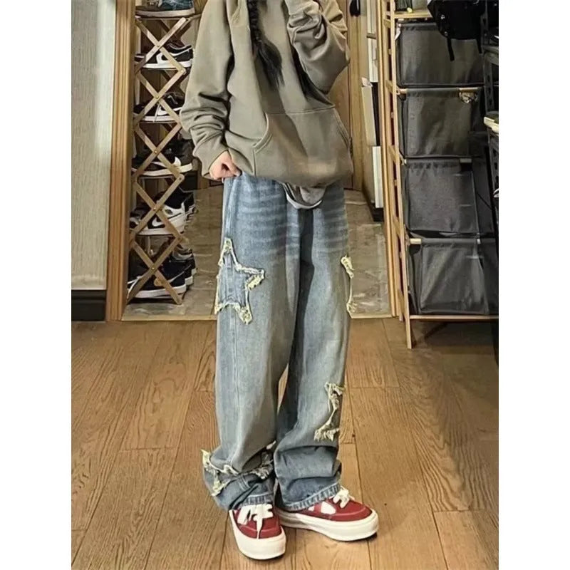 Blue wide-leg high-waist denim trousers with straight leg design laid flat