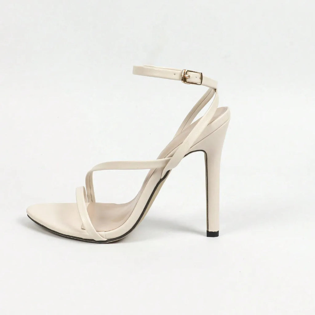 Women's gold open toe sandals with cross ankle strap and round toe design on rubber sole