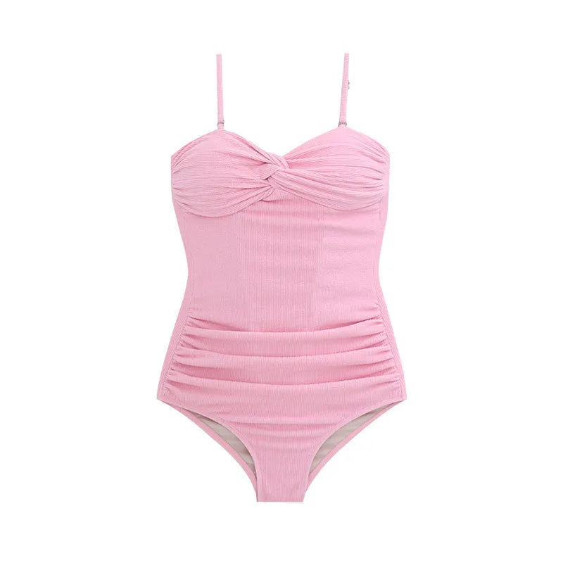 Women's black high-waisted one-piece swimsuit with removable shoulder straps on a mannequin.