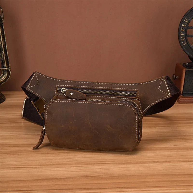 Brown top layer cowhide men's sports waist bag showing pull closure and internal mobile phone pocket