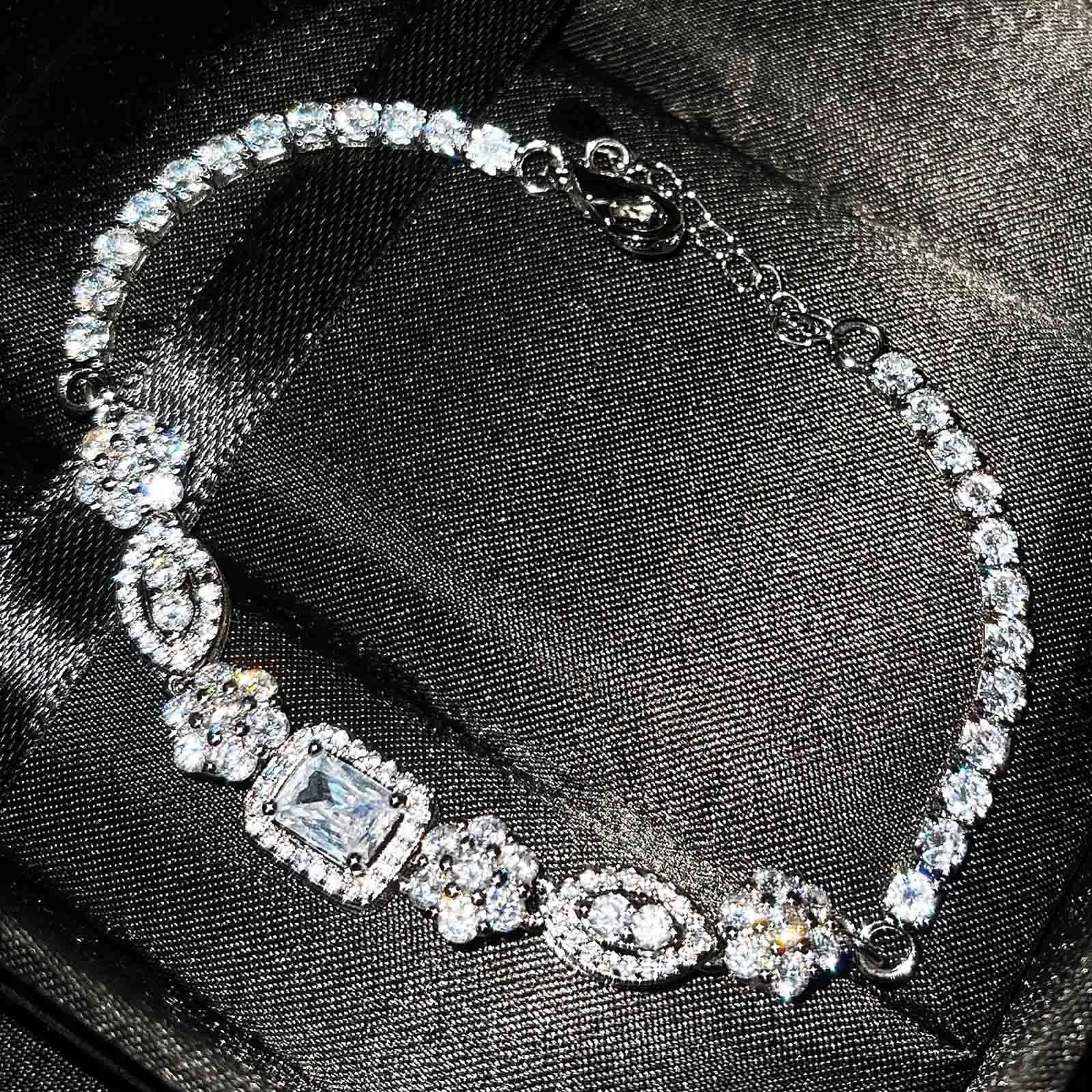 Women's white gold plated geometric bracelet with zircon stones in two length options.