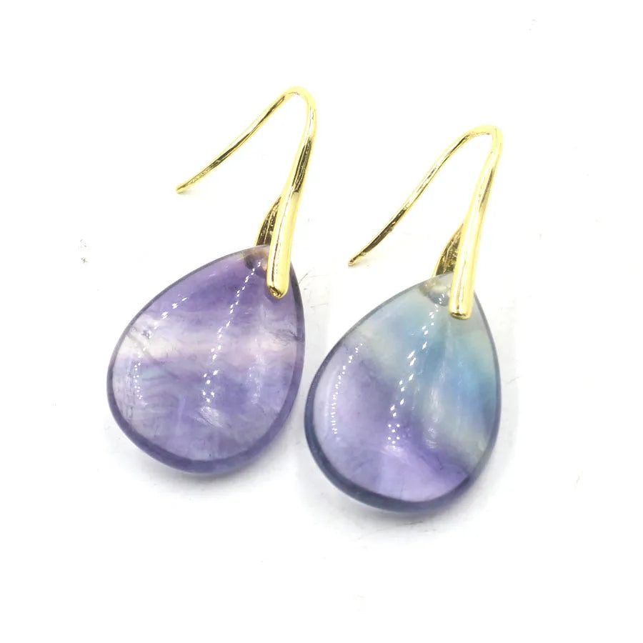 Geometric crystal water drop earrings in amethyst colour with electroplated metal setting.