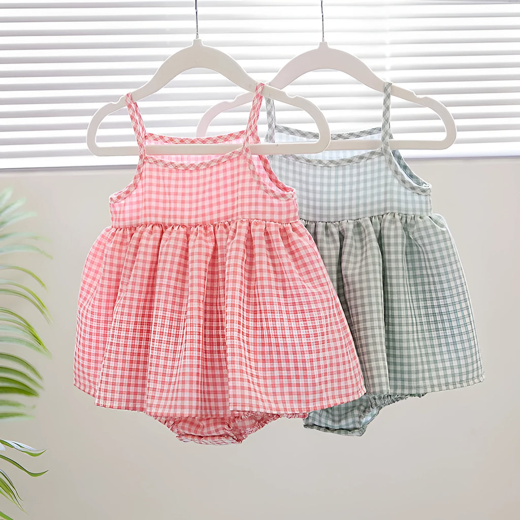 Baby girl in Korean style plaid princess sling romper dress in light green on white background