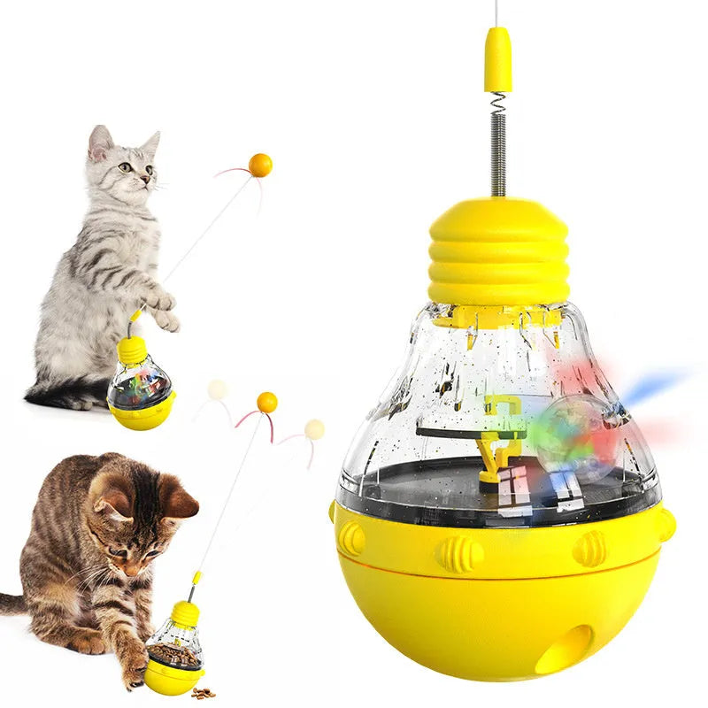 Electric yellow cat wand toy with teaser stick, plastic ball and slow feed dispenser on rocking base