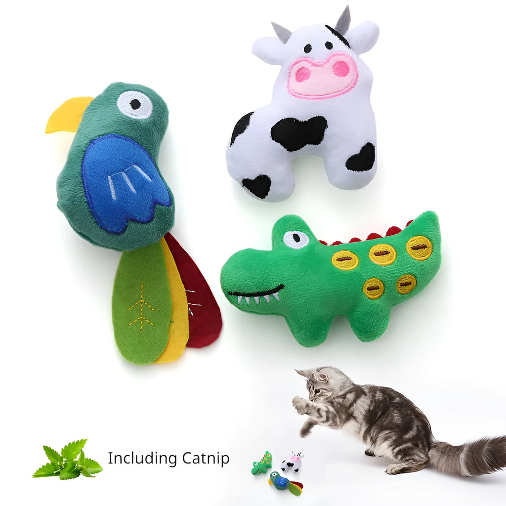 Colourful plush cat toy shaped like a cow, a crocodile, or a parrot on a plain background.