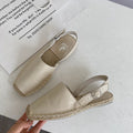 Women's beige retro fisherman flat sandals with canvas upper and animal pattern.