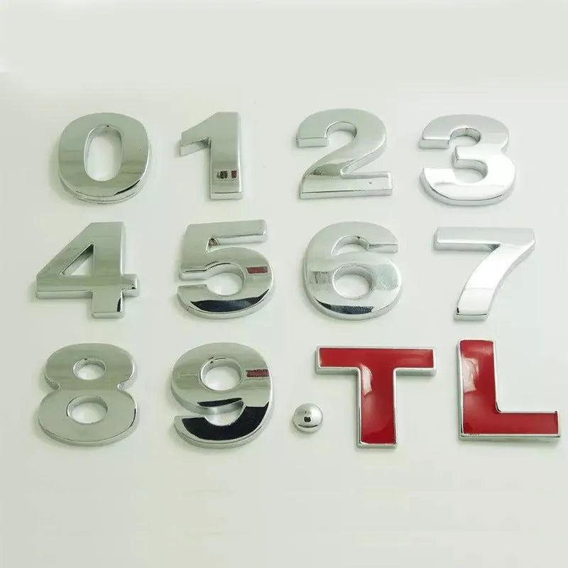 3D metal zinc alloy car letter sticker showing raised silver letter on clear adhesive backing.
