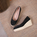 Women's apricot wedge heel pumps with rope-textured sole and shallow V-cut opening on a white background.