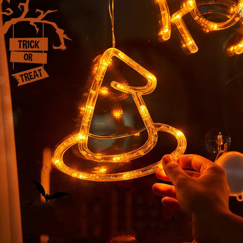 Seven Halloween-themed LED hanging lights with suction cups including spiders, pumpkins and ghosts