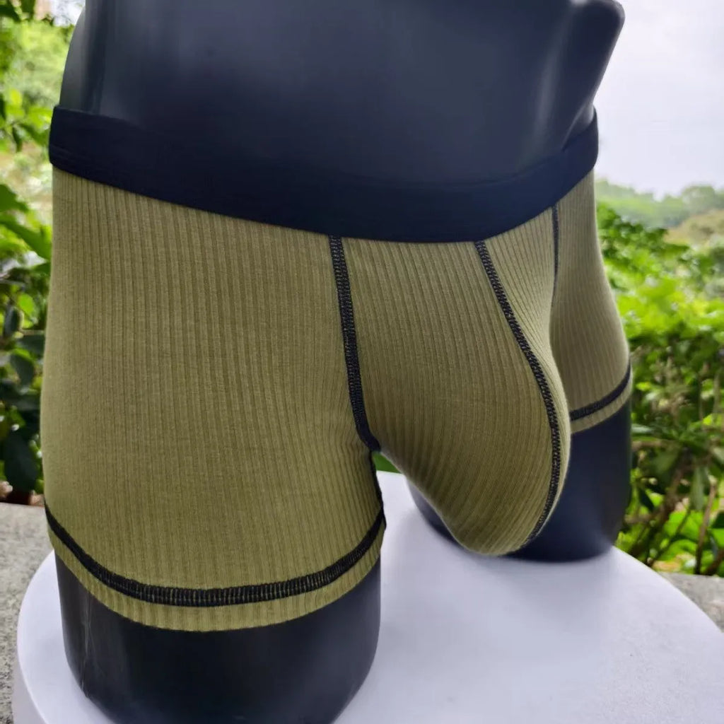 Men's slim-fit breathable boxer shorts in solid colours, shown in size range L to 3XL.