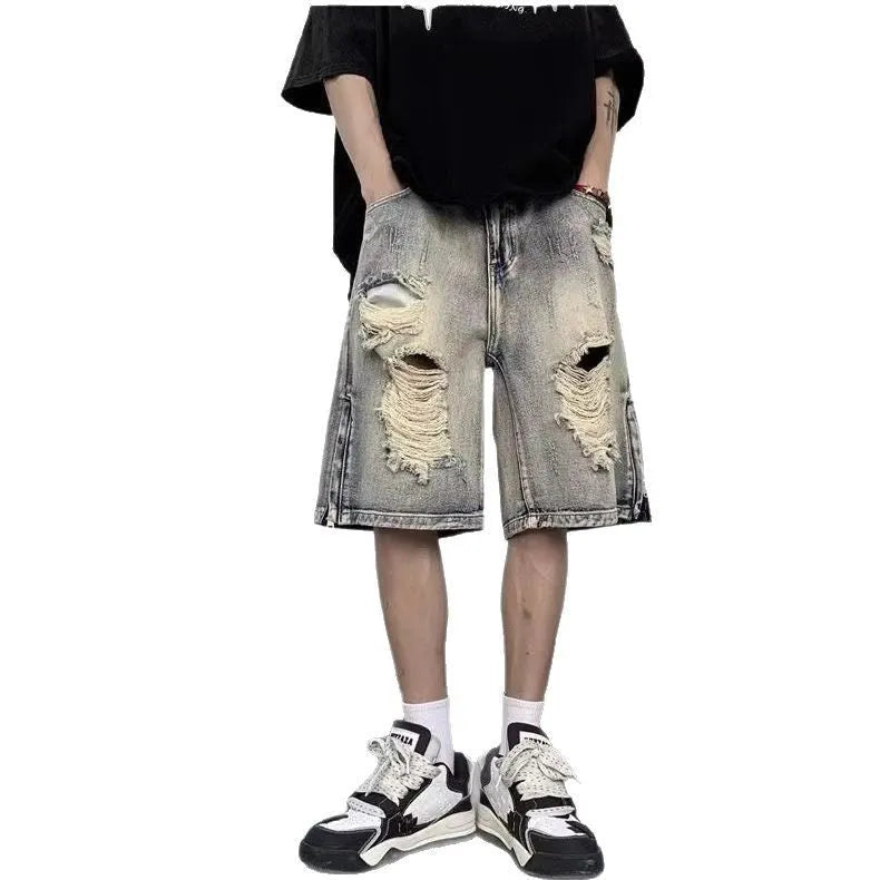 Blue retro tattered denim shorts with a wide leg loose fit on a mannequin