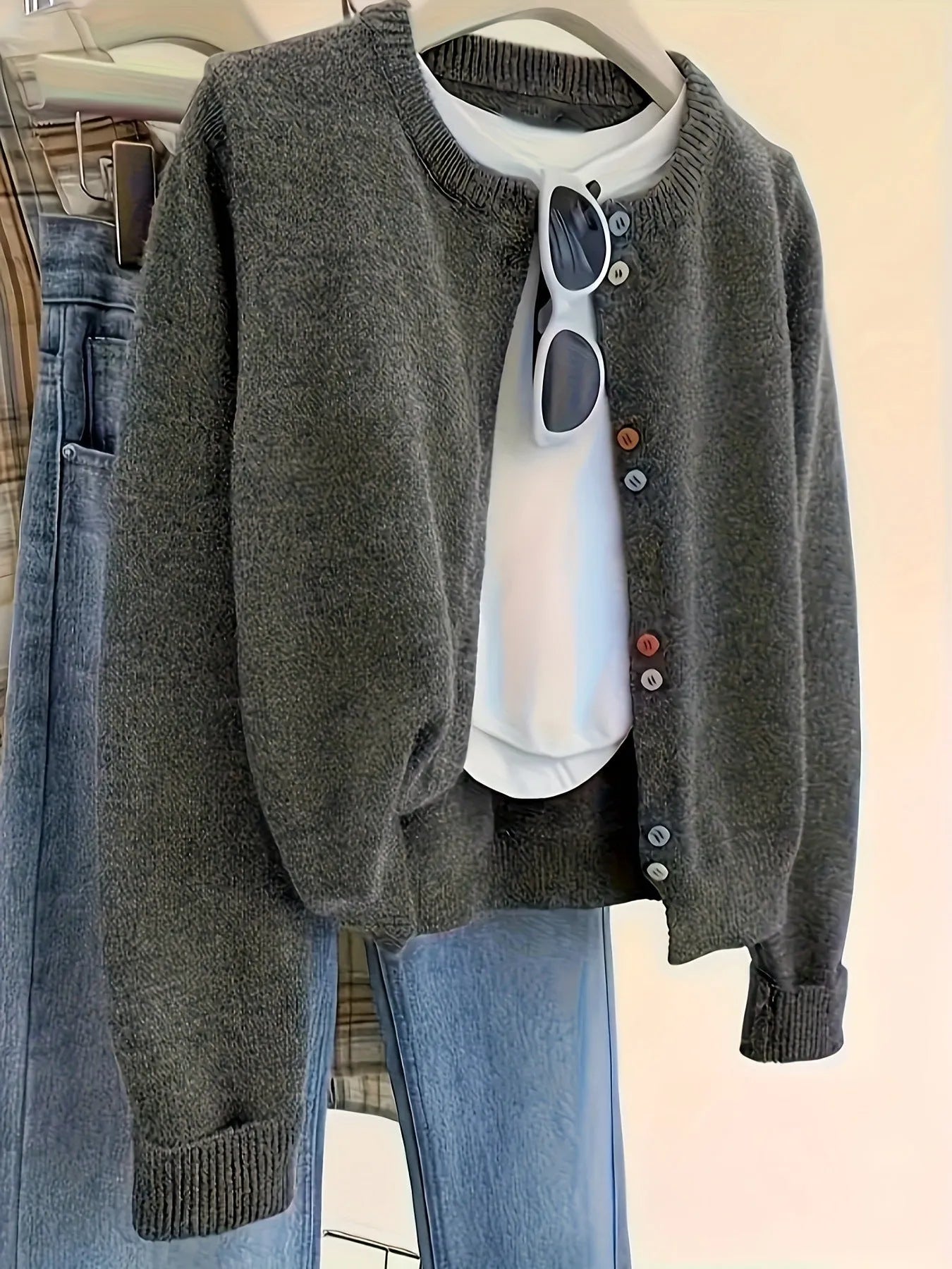 Dark grey women's cardigan sweater with button front and regular sleeves for office commuting