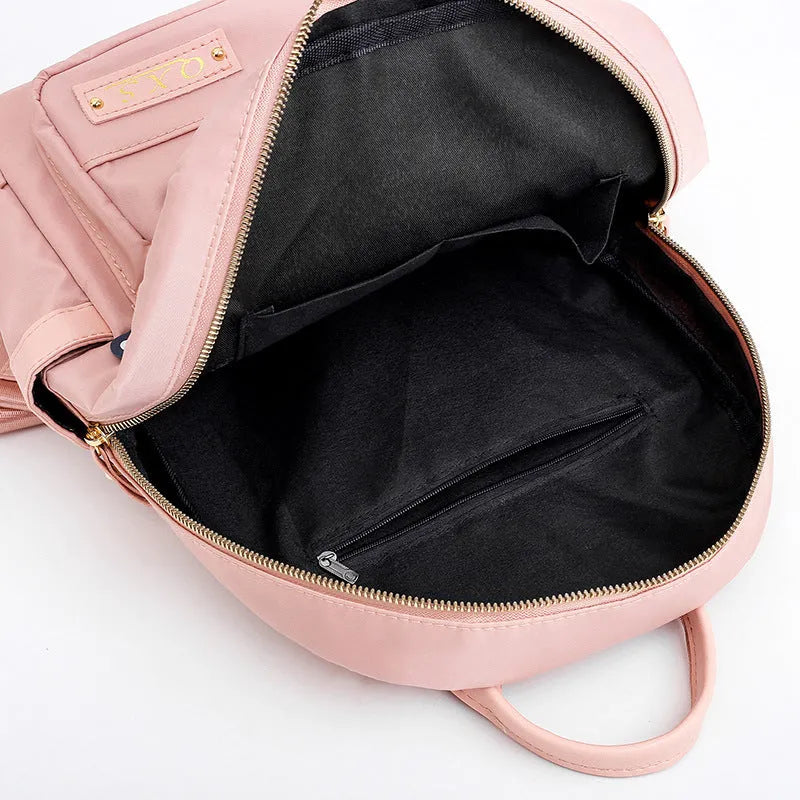 Soft nylon casual backpack in black or pink with three-dimensional pockets and double shoulder straps